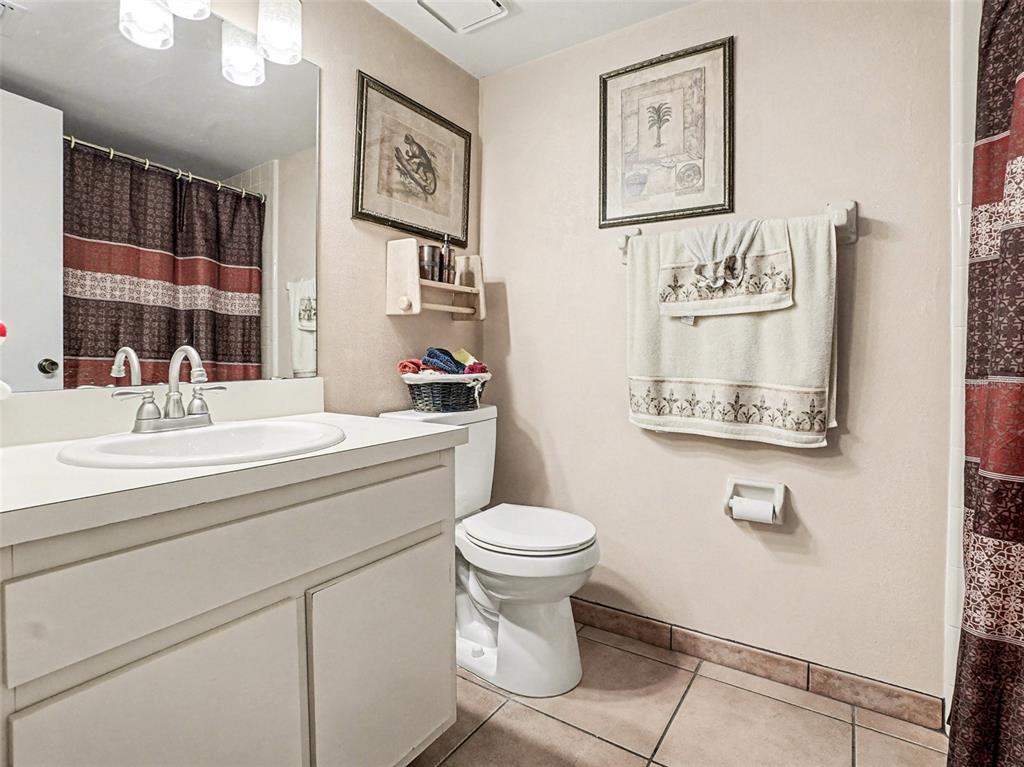 1052 Lotus Cove Court, Unit 733 Altamonte Springs, FL 32714 - Photo 19 of 28 a bathroom with a toilet a sink and a mirror