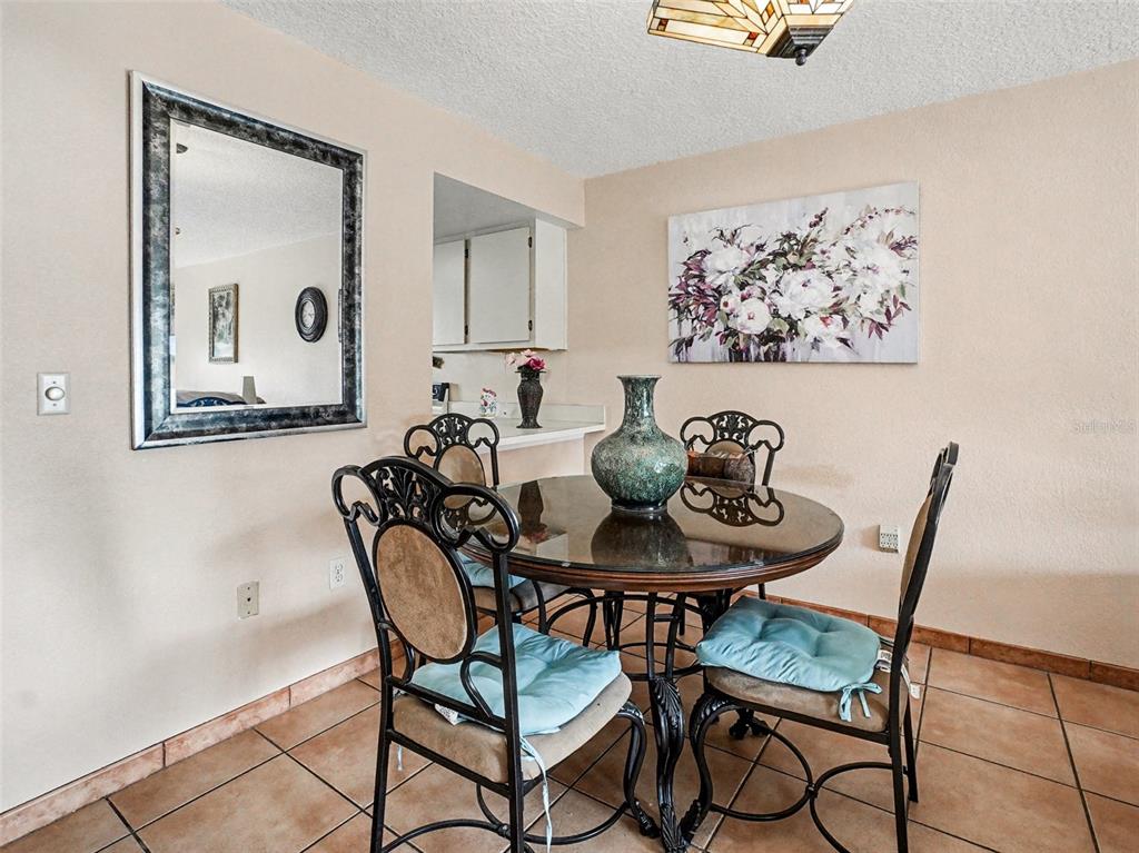 1052 Lotus Cove Court, Unit 733 Altamonte Springs, FL 32714 - Photo 20 of 28 a view of a dining room with furniture and wooden floor