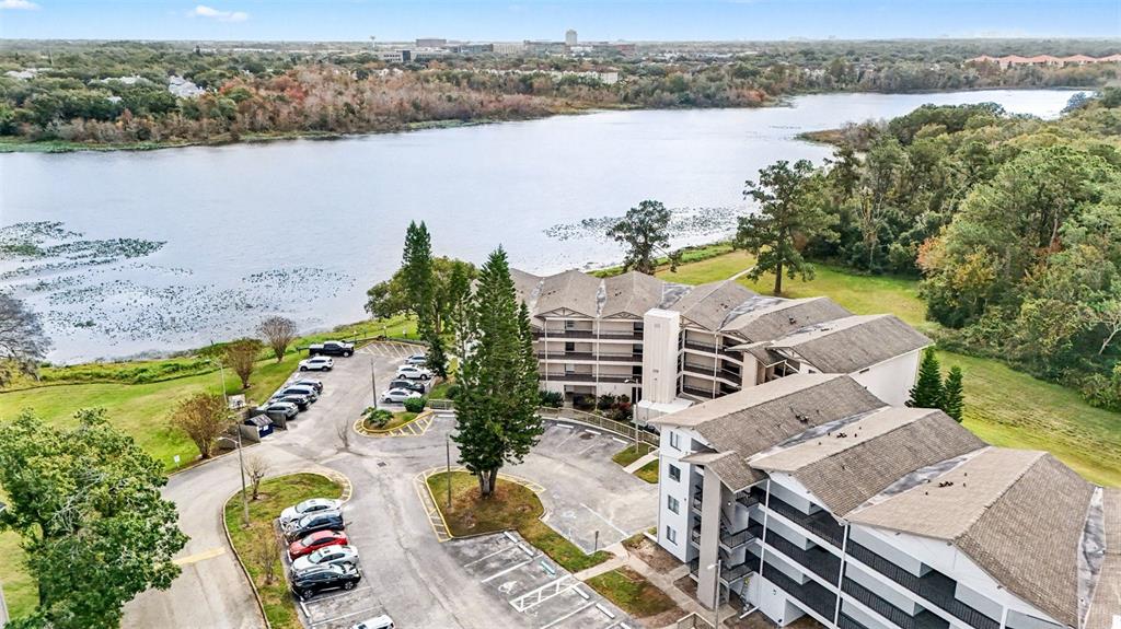 1052 Lotus Cove Court, Unit 733 Altamonte Springs, FL 32714 - Photo 2 of 28 an aerial view of a house with outdoor space and lake view