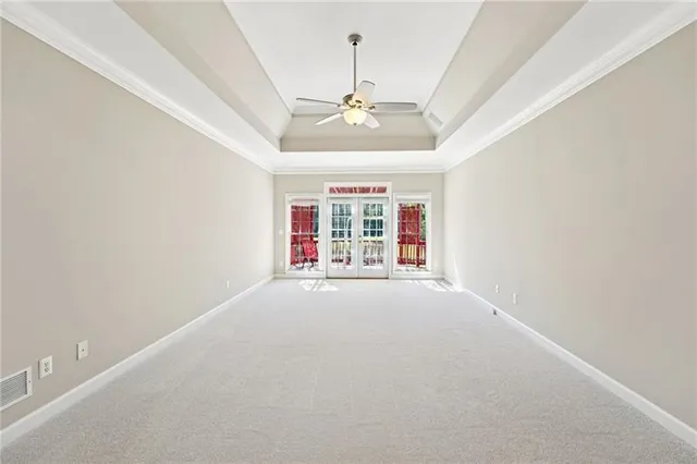 a view of a closet with white walls