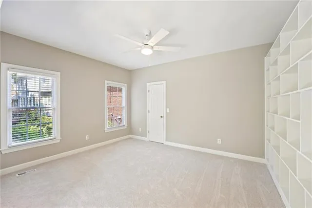 a bathroom with a sink a toilet and shower curtain