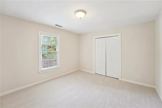 a bathroom with a sink a toilet and shower curtain