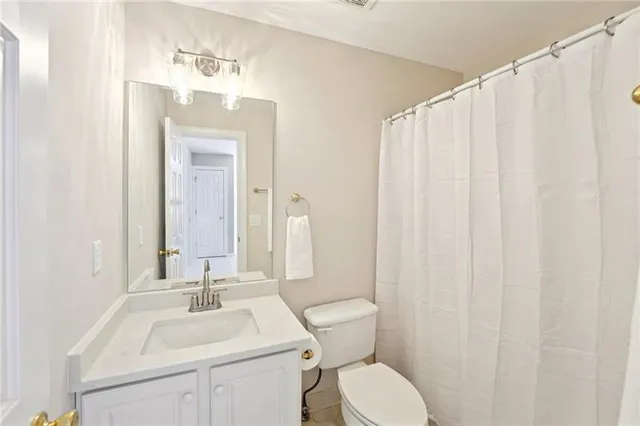 a view of a house with backyard porch and sitting area