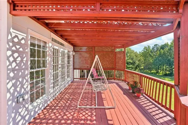 a front view of a house with a garden and plants