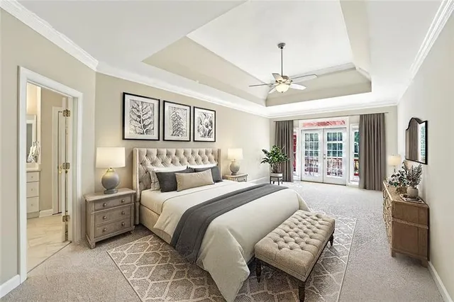 a spacious bedroom with a bed a chandelier and a window
