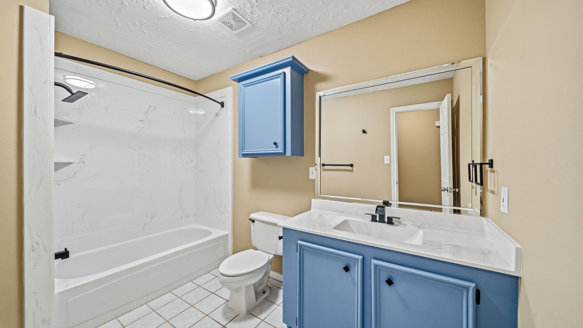 417 Shawnee Conroe, TX 77316 - Photo 12 of 18 Secondary bathroom with new countertops and storage.