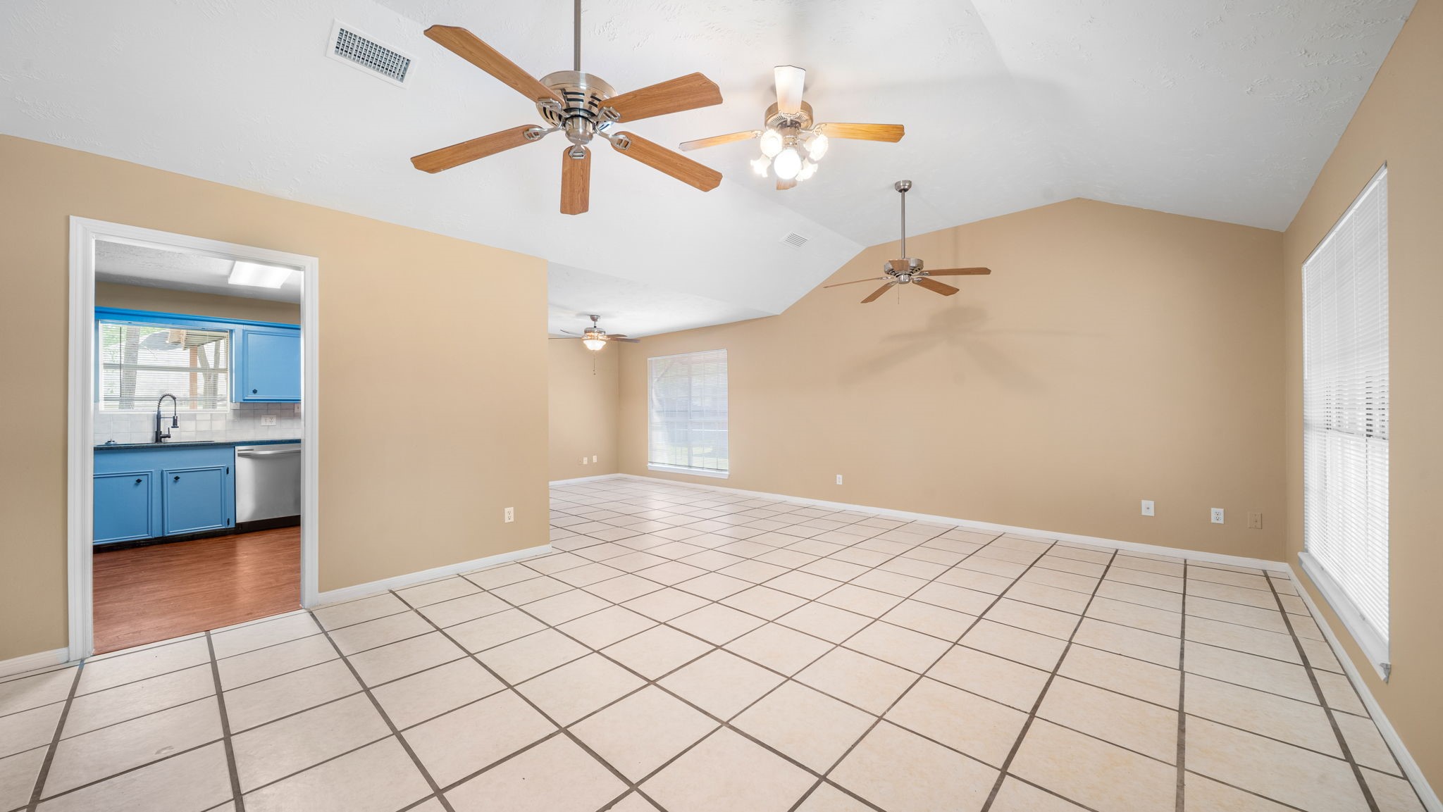 417 Shawnee Conroe, TX 77316 - Photo 2 of 18 Walk into the open and airy living area.