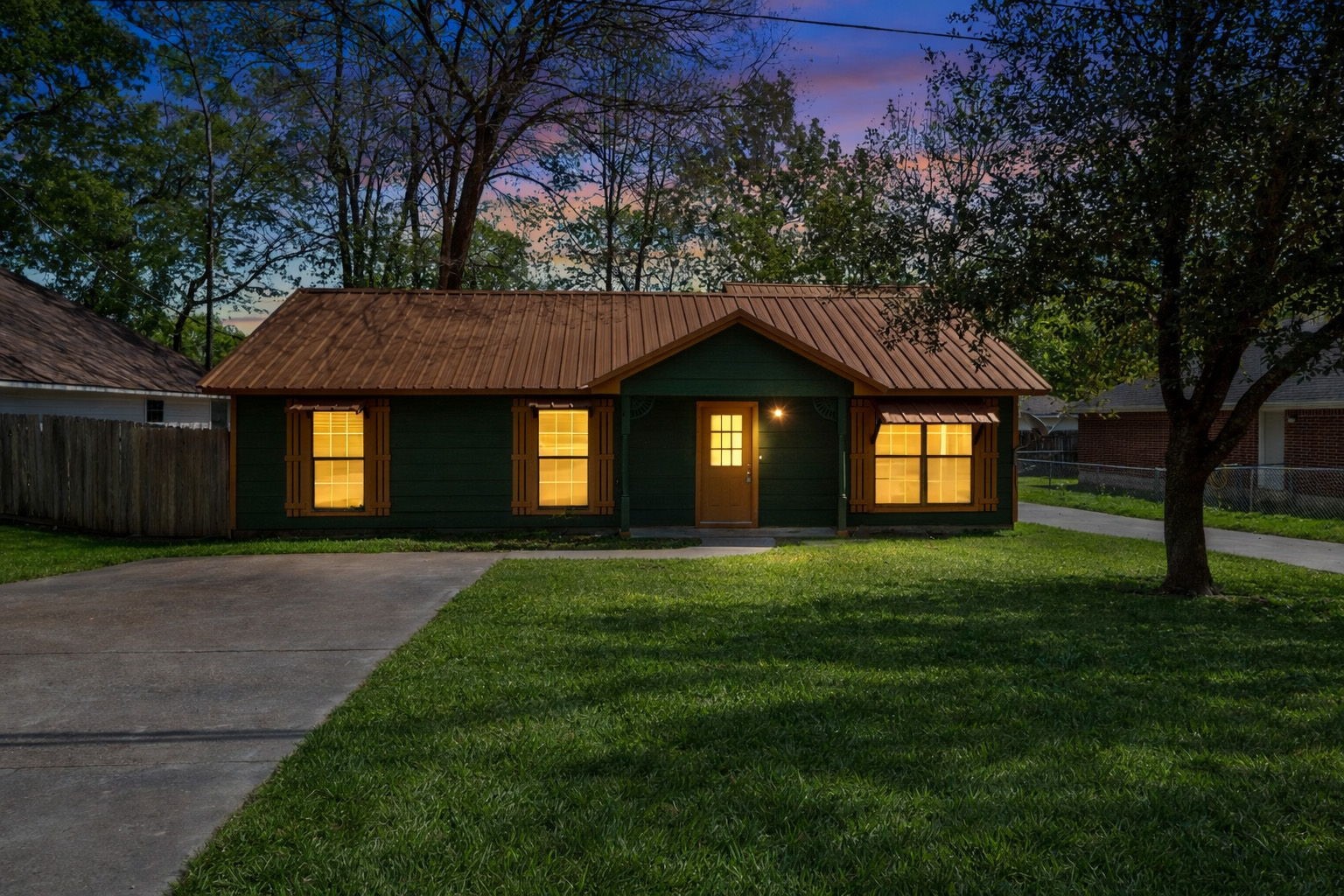 417 Shawnee Conroe, TX 77316 - Photo 2 of 18 Enjoy evenings in the mature trees of Lake Conroe Forest