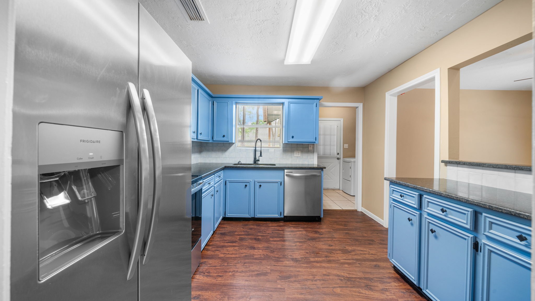 417 Shawnee Conroe, TX 77316 - Photo 7 of 18 Functional kitchen design with abundant storage and prep space.