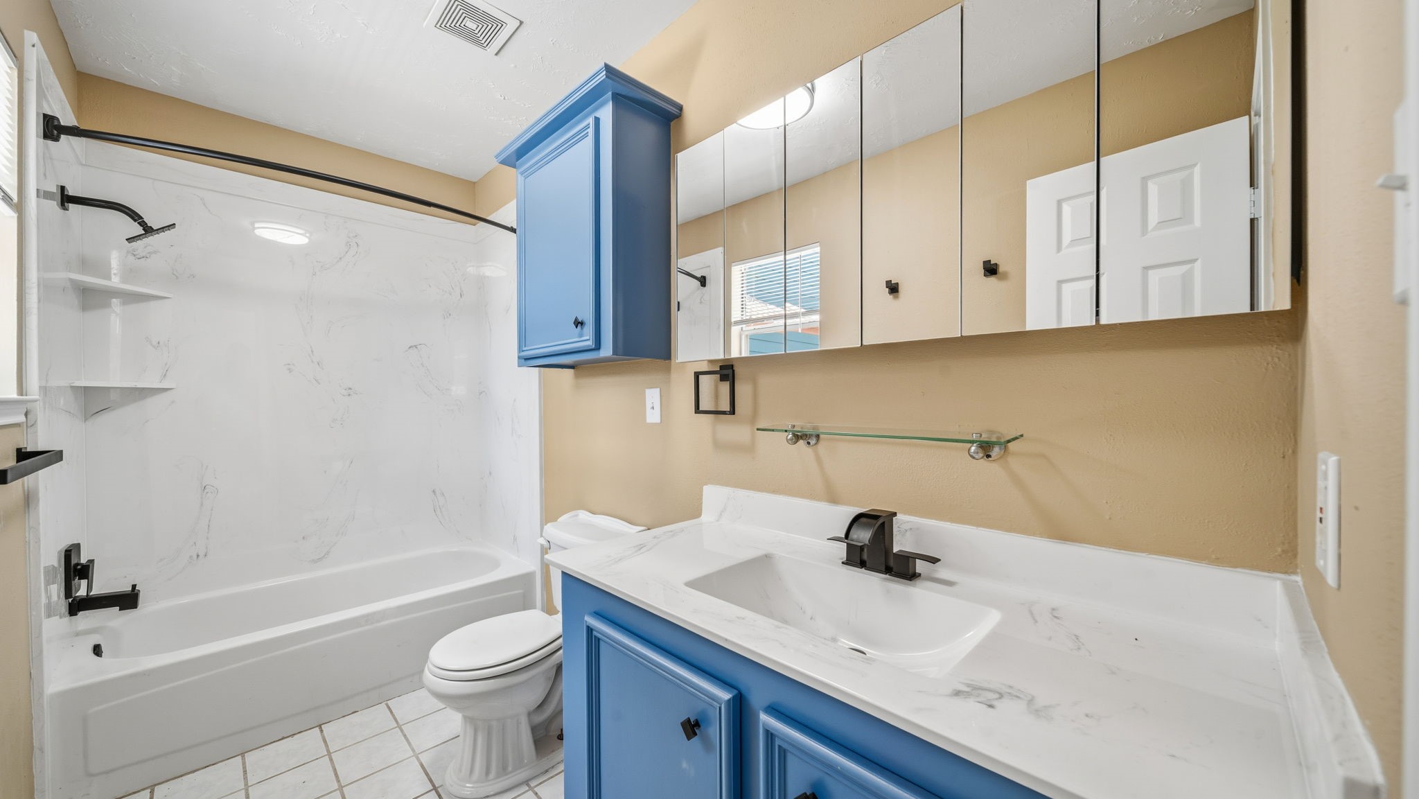 417 Shawnee Conroe, TX 77316 - Photo 10 of 18 Primary bathroom with new countertop and tons of storage.