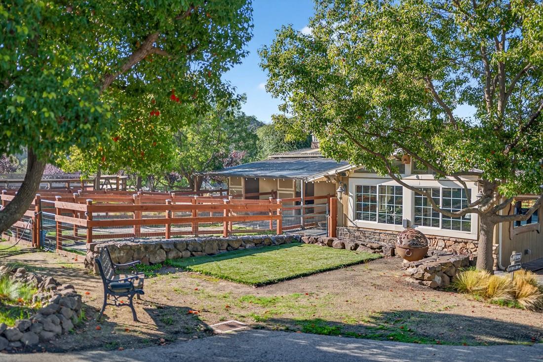 3970 Leavesley Road Gilroy, CA 95020 - Photo 13 of 52 a front view of a house with a yard table and chairs