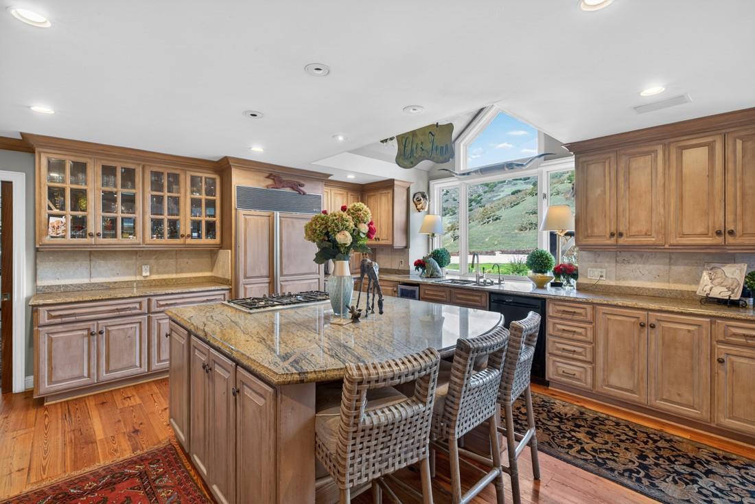 3970 Leavesley Road Gilroy, CA 95020 - Photo 20 of 52 a kitchen with stainless steel appliances granite countertop a sink and a refrigerator
