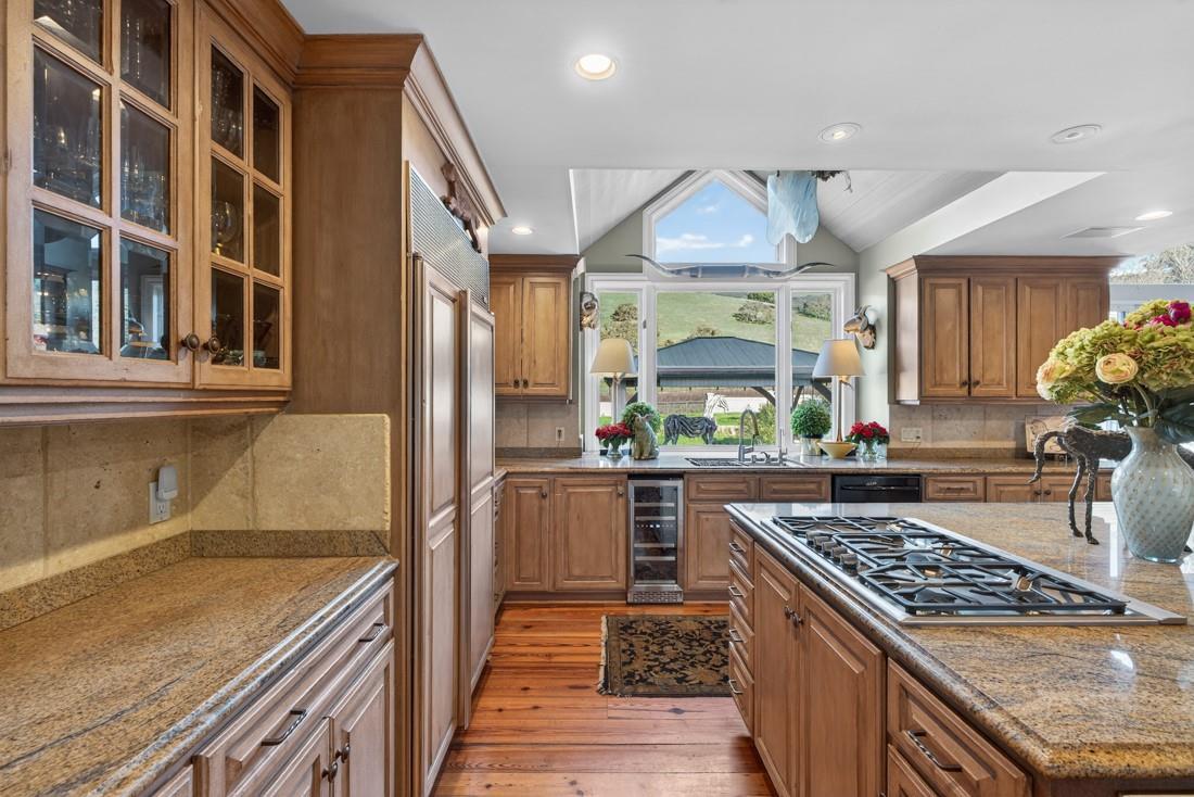 3970 Leavesley Road Gilroy, CA 95020 - Photo 21 of 52 a kitchen with stainless steel appliances granite countertop a stove and a sink