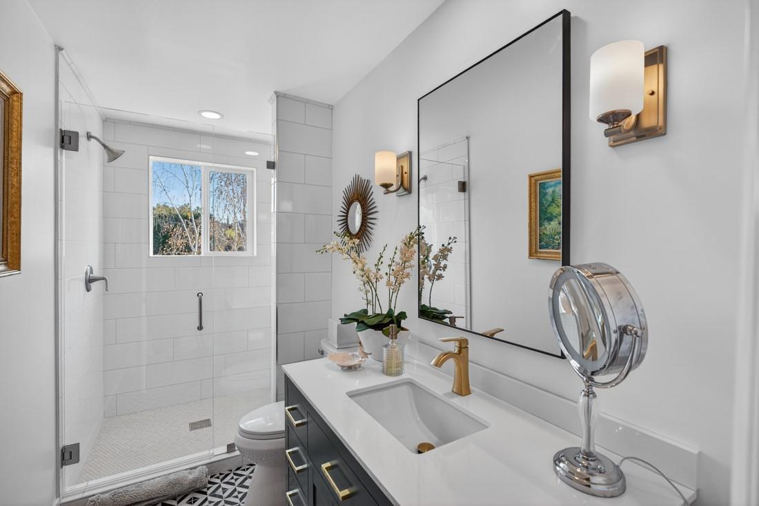 3970 Leavesley Road Gilroy, CA 95020 - Photo 31 of 52 a bathroom with a sink a toilet and shower