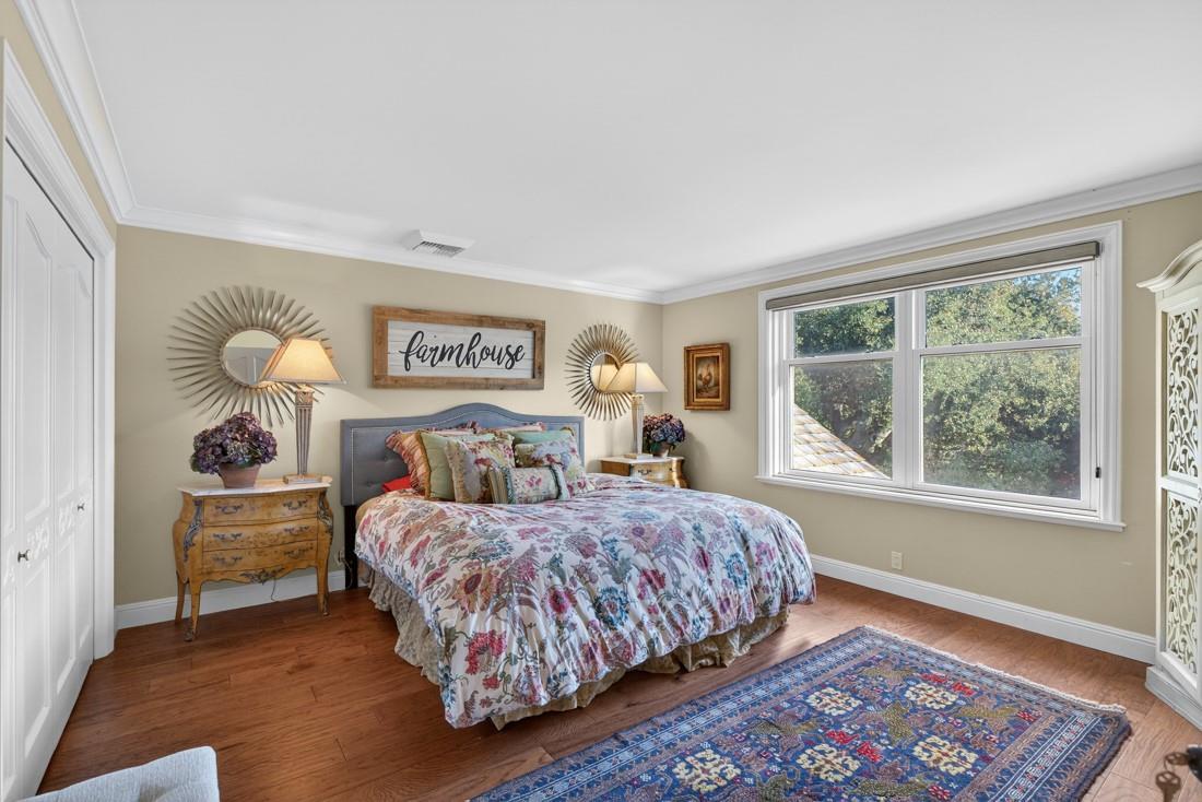 3970 Leavesley Road Gilroy, CA 95020 - Photo 32 of 52 a bedroom with a bed and a lamp on dresser