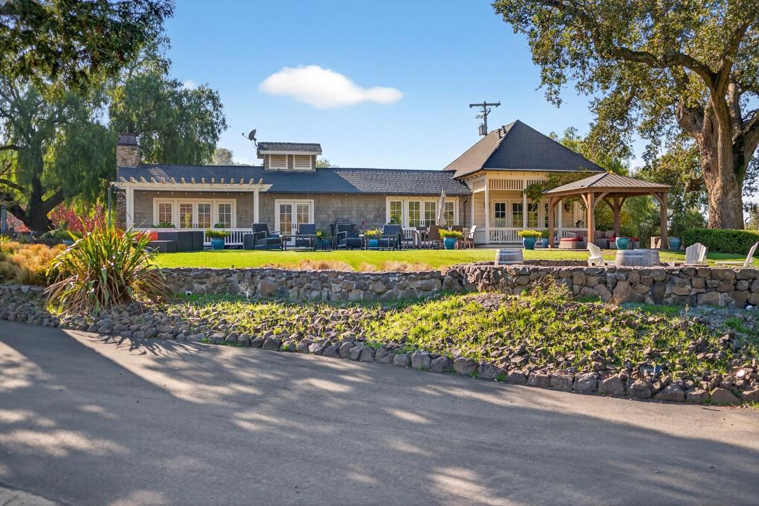 3970 Leavesley Road Gilroy, CA 95020 - Photo 7 of 52 a front view of a house with a yard and lake view