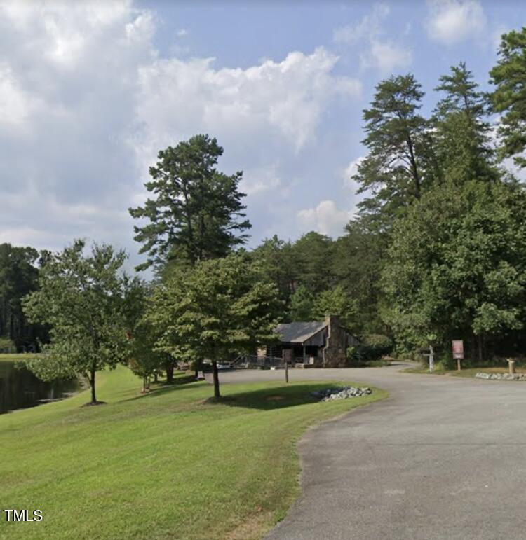 4524 West Millstone Drive Burlington, NC 27215 - Photo 14 of 22 a view of a park with large trees