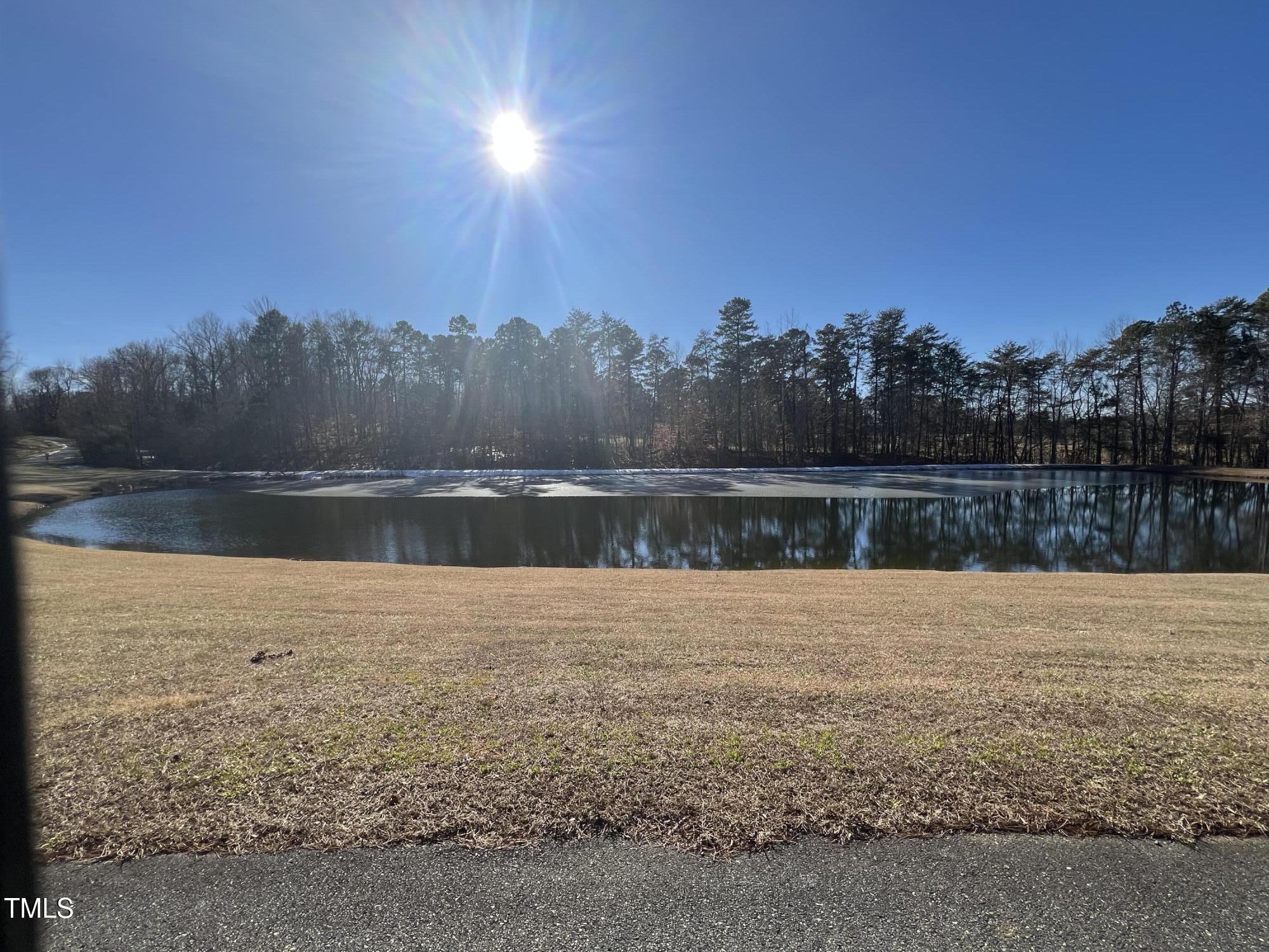 4524 West Millstone Drive Burlington, NC 27215 - Photo 19 of 22 a view of outside space with a lake