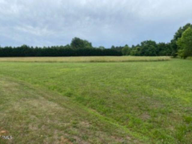 4524 West Millstone Drive Burlington, NC 27215 - Photo 4 of 22 a view of a lake and a big yard