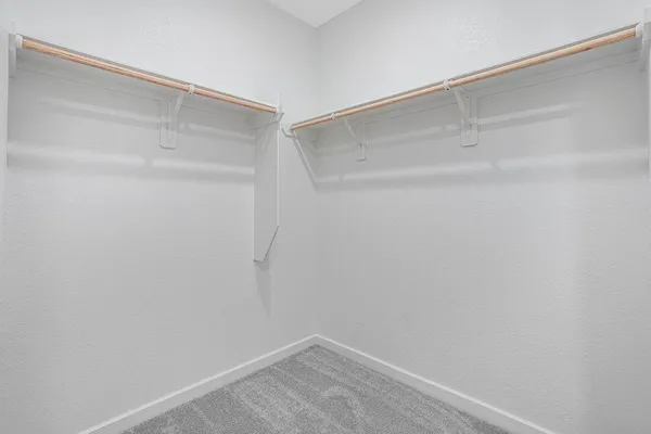a view of an empty walk in closet