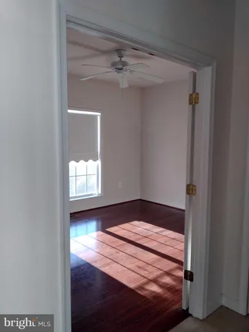 a view of wooden floor in an empty room