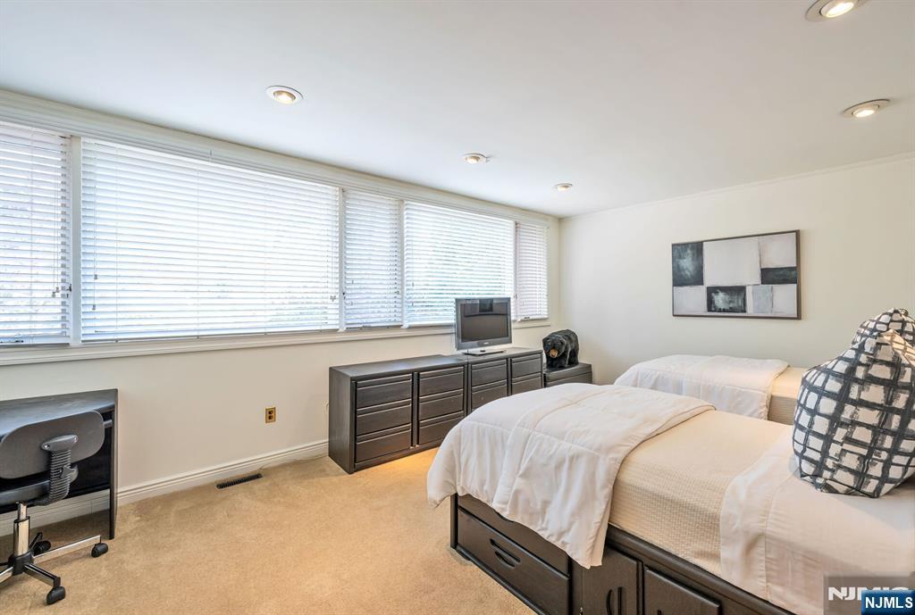 84 Bogerts Mill Road Harrington Park, NJ 07640 - Photo 29 of 47 a bedroom with a bed and a window