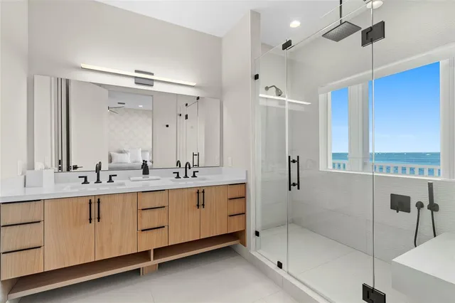 a view of a room with wooden floor and a potted plant