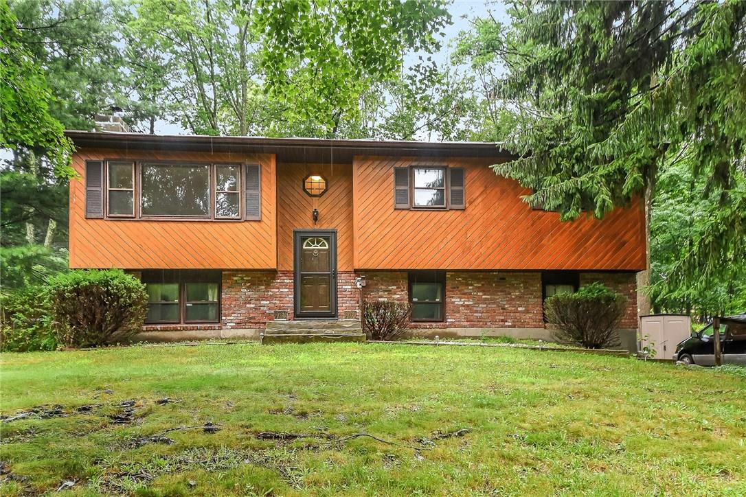 74 Heaton Road Monroe, NY 10950 - Photo 1 of 1 a front view of a house with garden