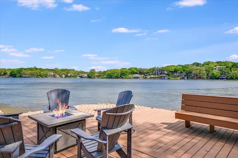 a view of a lake with furniture