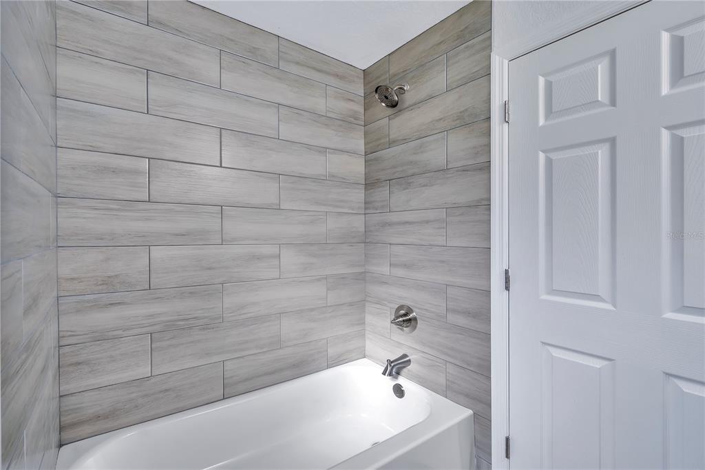 833 3rd Avenue Dundee, FL 33838 - Photo 18 of 37 a bathroom with a sink a toilet and shower