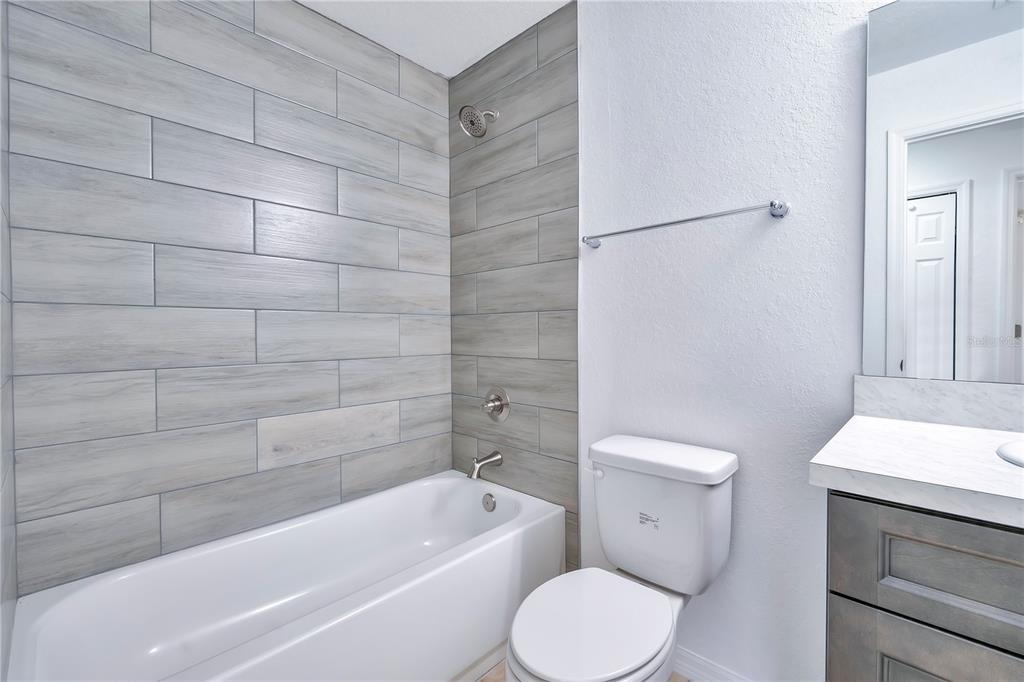 833 3rd Avenue Dundee, FL 33838 - Photo 23 of 37 a bathroom with a toilet and a bathtub