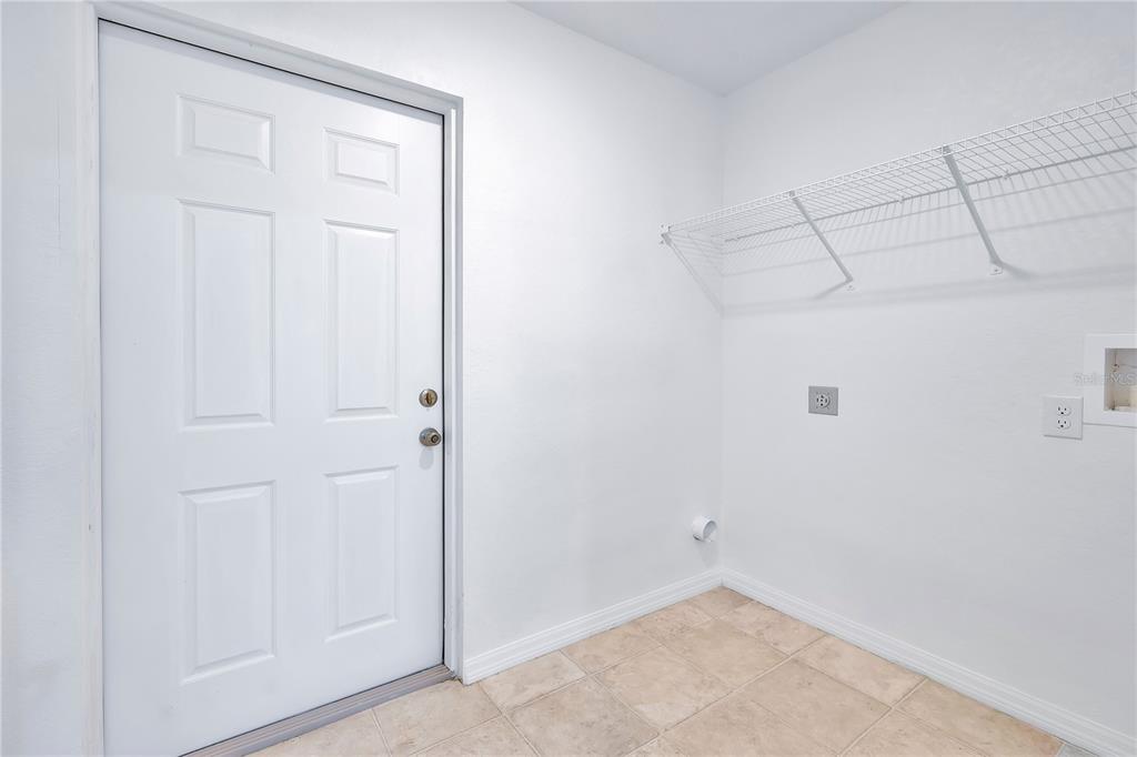 833 3rd Avenue Dundee, FL 33838 - Photo 26 of 37 a view of a room with racks on the wall