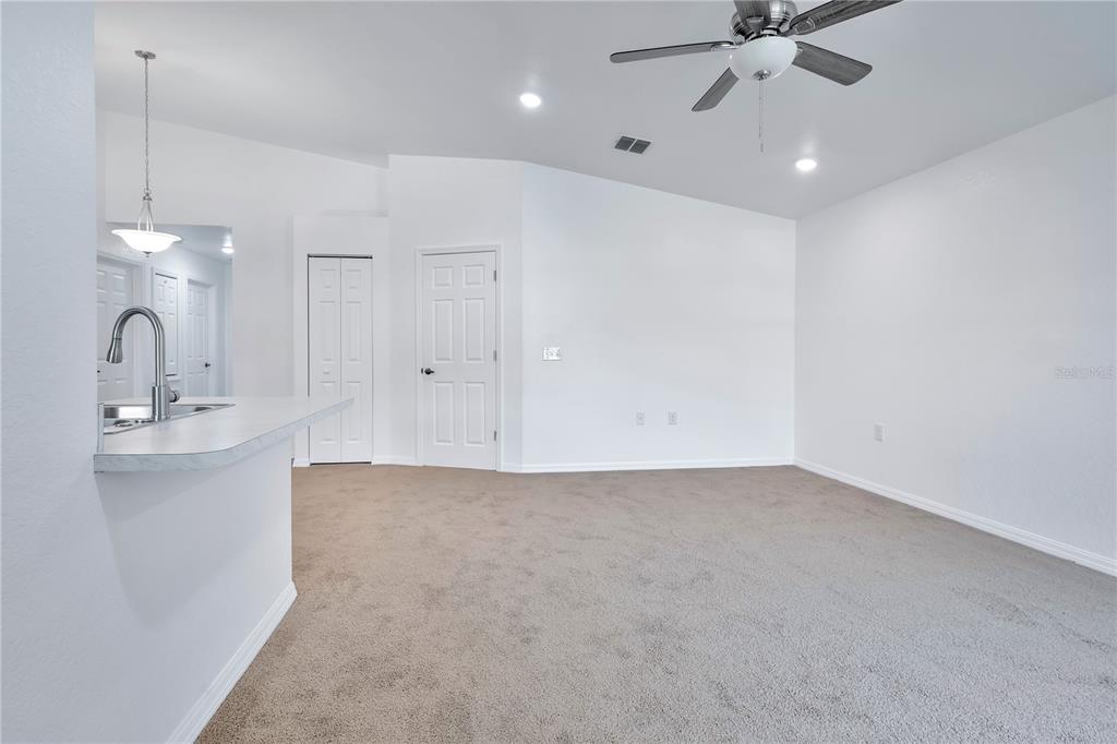833 3rd Avenue Dundee, FL 33838 - Photo 7 of 37 a view of a kitchen with a sink and cabinets