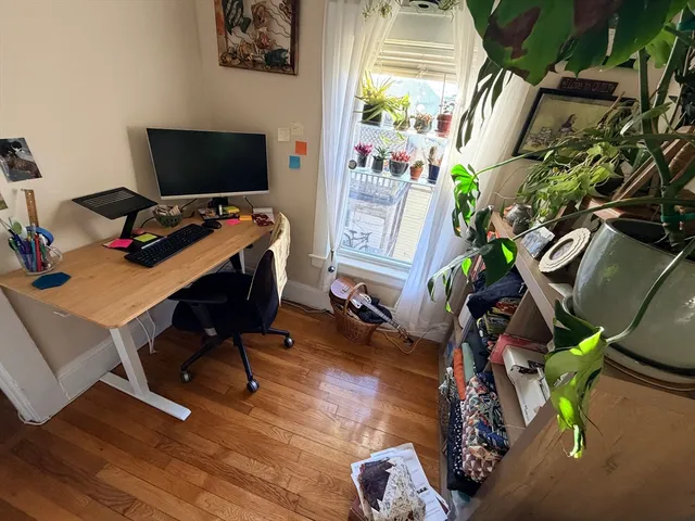 a view of a workspace with furniture
