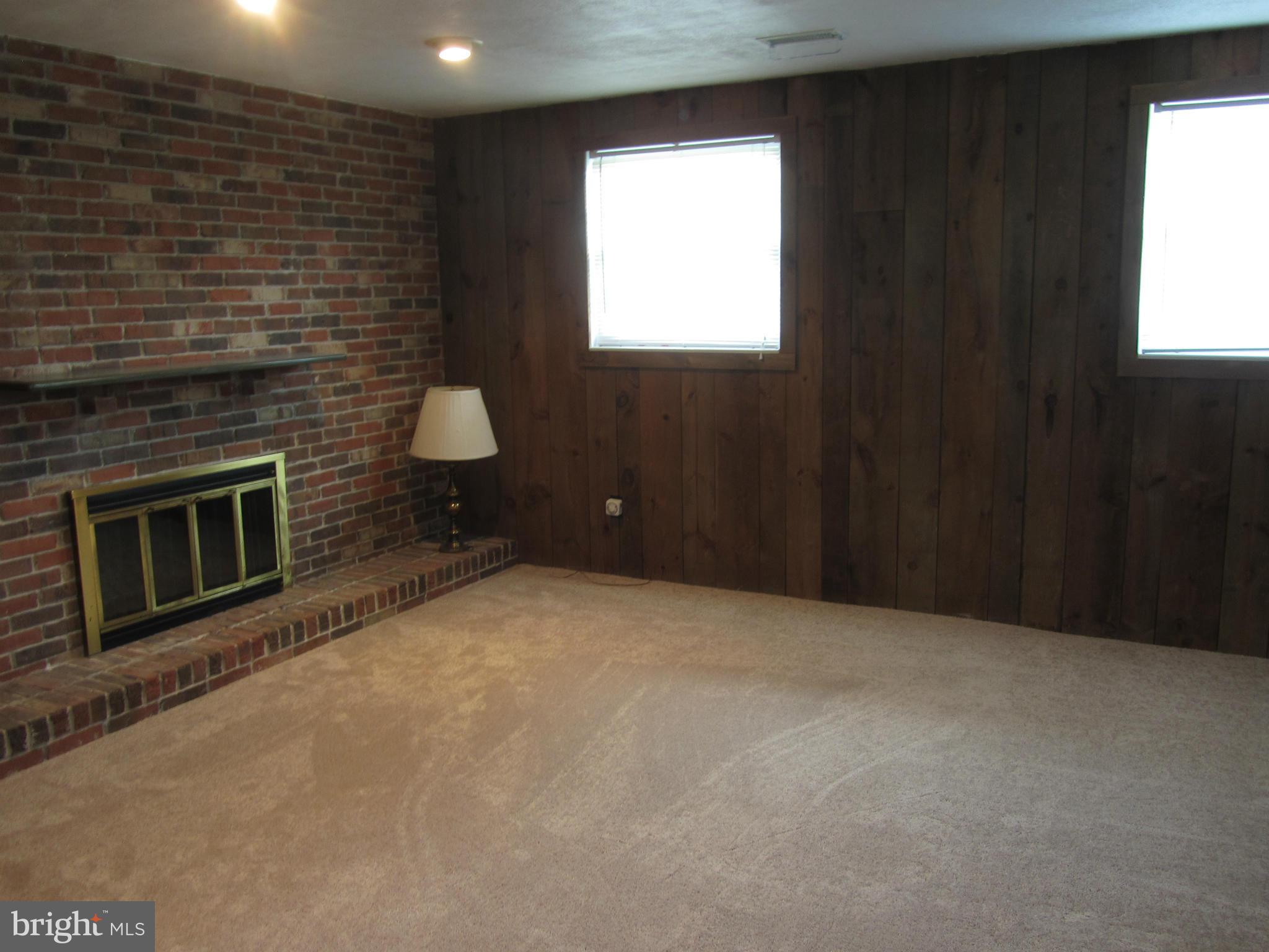 9003 Transoms Road Baltimore, MD 21236 - Photo 17 of 29 a view of a livingroom with furniture and a fireplace