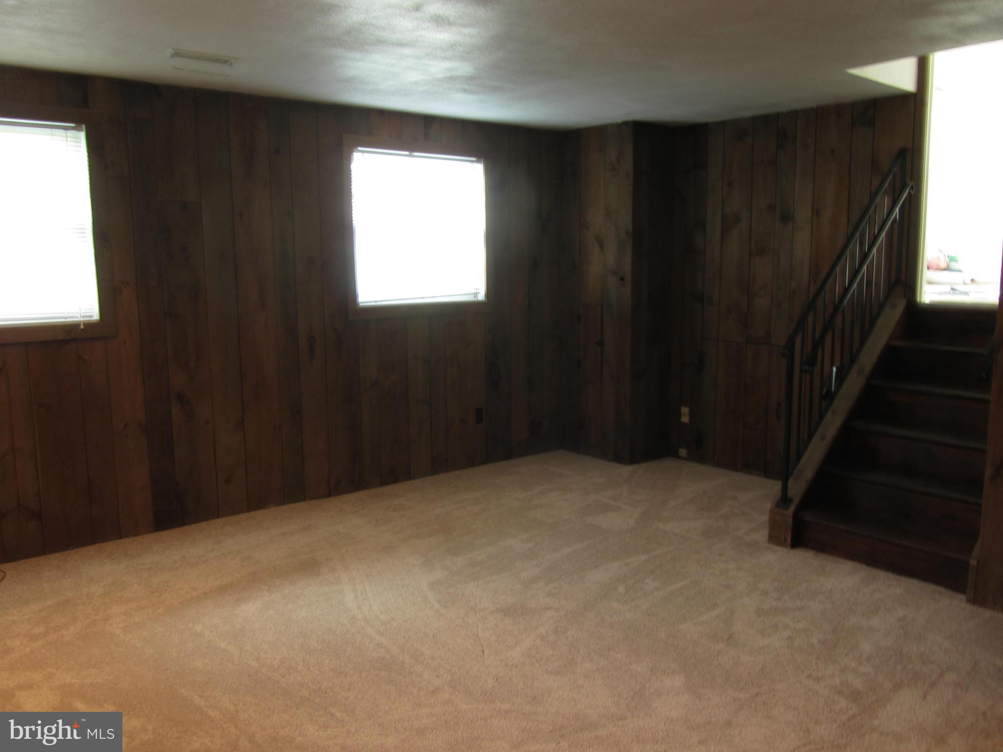 9003 Transoms Road Baltimore, MD 21236 - Photo 18 of 29 wooden floor in an empty room with a window