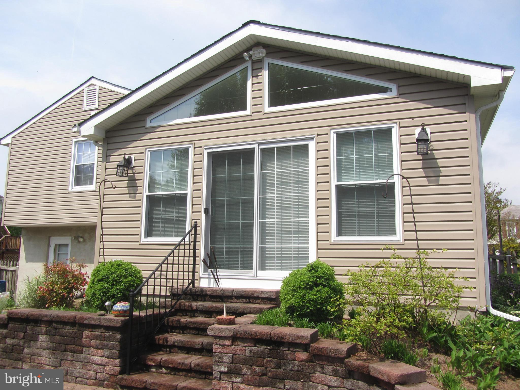 9003 Transoms Road Baltimore, MD 21236 - Photo 19 of 29 a front view of a house with a yard