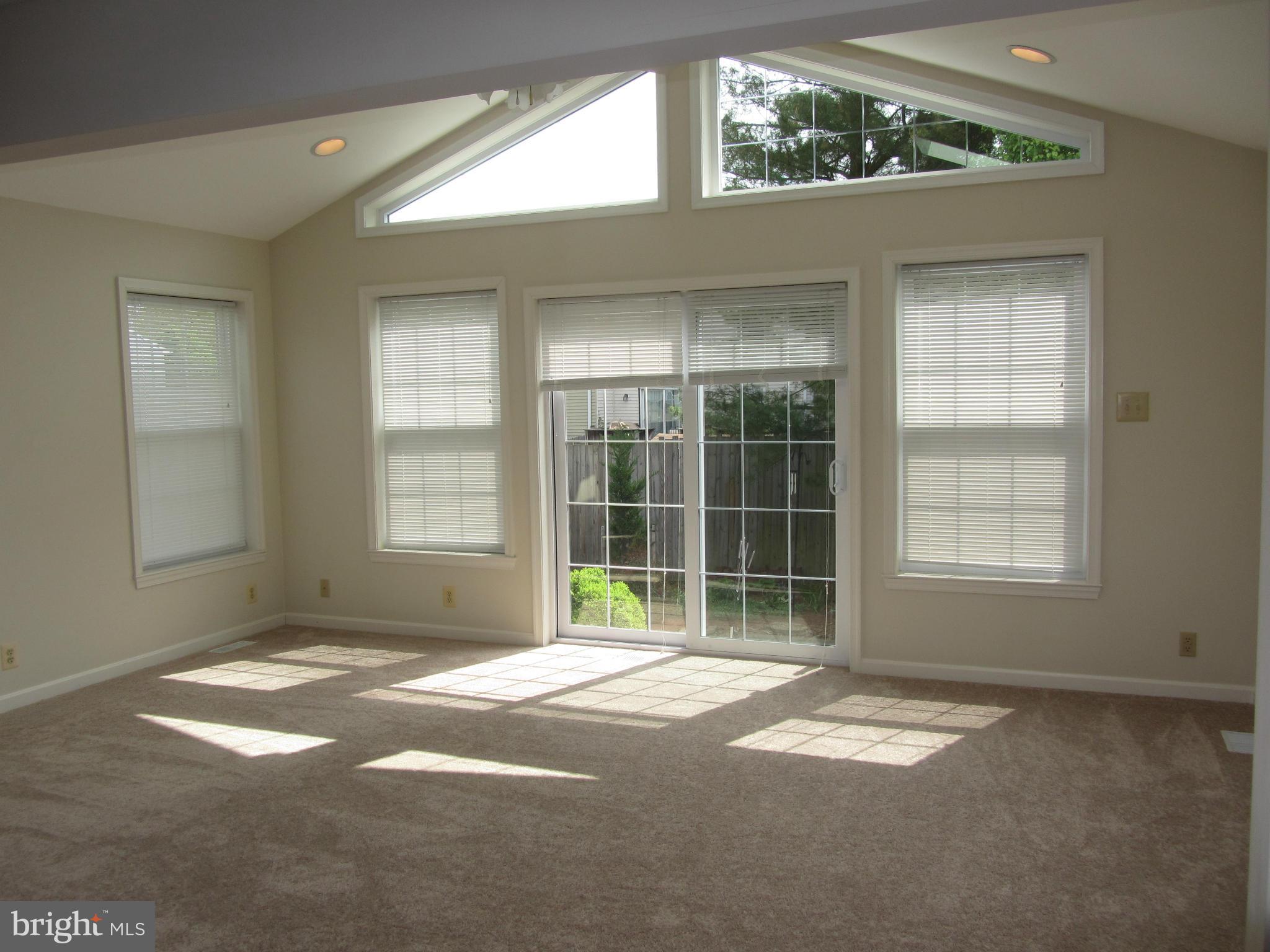 9003 Transoms Road Baltimore, MD 21236 - Photo 7 of 29 a view of a big room with windows and entryway