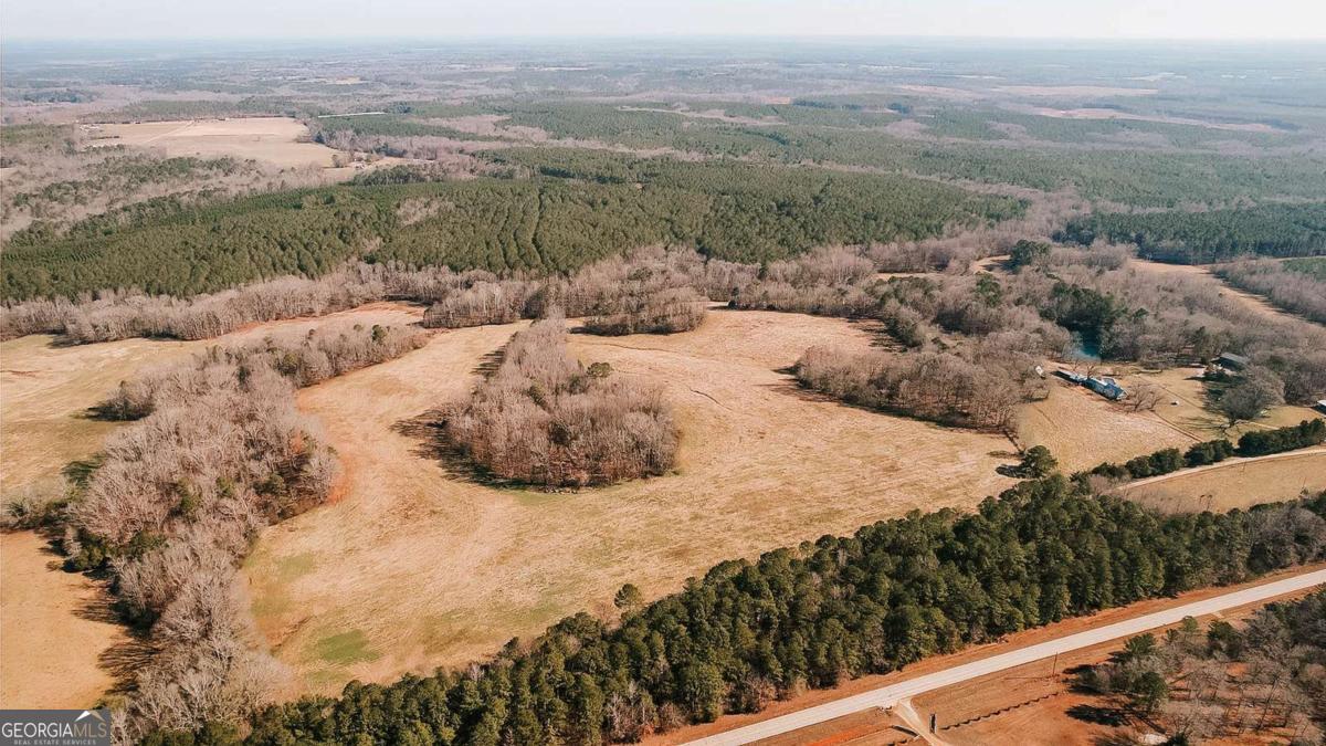 0 Lovers Lane Stephens, GA 30667 - Photo 13 of 20 a view of a forest with mountains and wooden fence