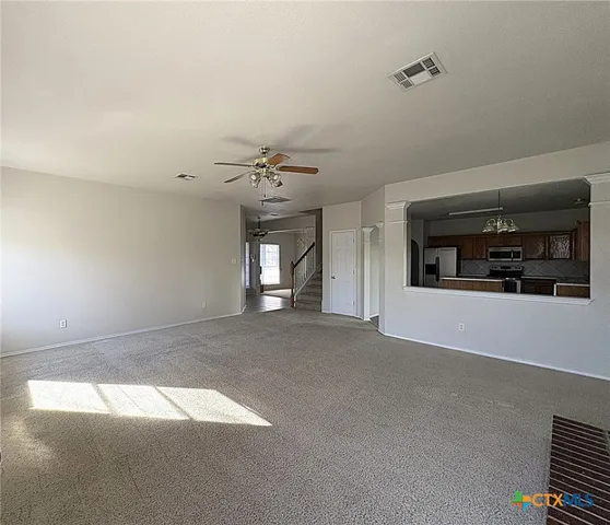 a view of a livingroom and window