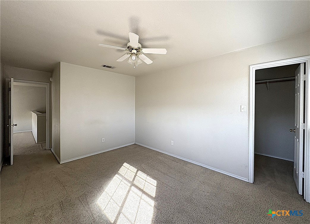 2313 Modoc Drive Harker Heights, TX 76548 - Photo 18 of 34 an empty room with windows and fan