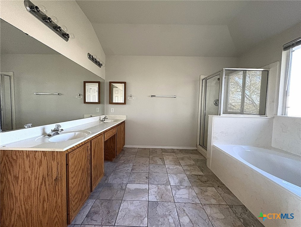2313 Modoc Drive Harker Heights, TX 76548 - Photo 24 of 34 a bathroom with a tub sink and mirror