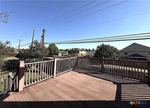 a view of balcony with wooden floor