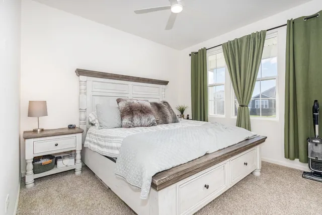 a bed room with a bed and a window