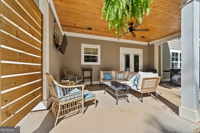 a balcony with table and chairs