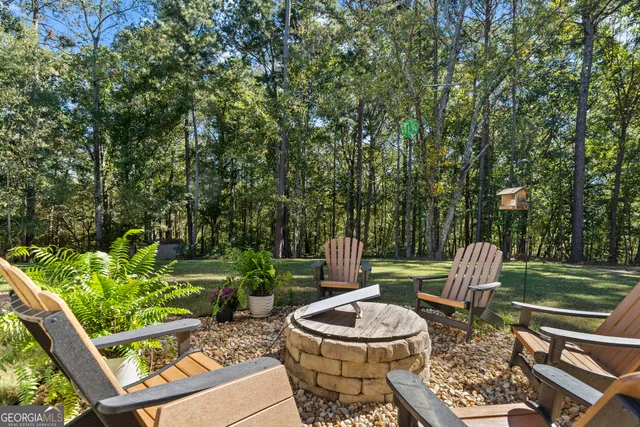a view of a patio with a dining table and chairs