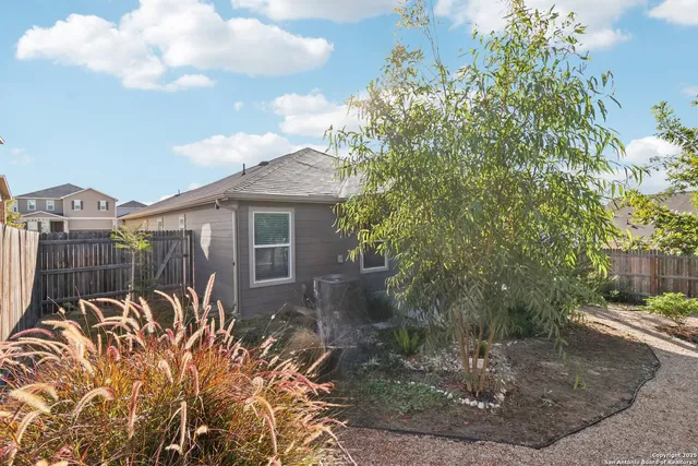 a backyard of a house with lots of green space