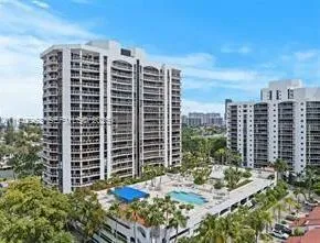 a view of a building with a yard