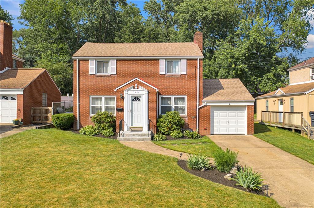 349 Rockhill Road Pittsburgh, PA 15243 - Photo 1 of 25 a front view of a house with yard and green space