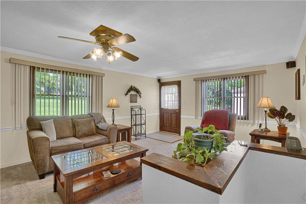 349 Rockhill Road Pittsburgh, PA 15243 - Photo 12 of 25 a living room with furniture and a large window